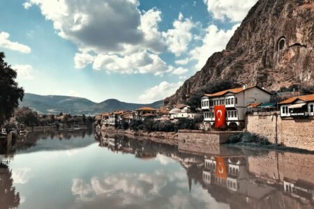buildings beside calm body of water