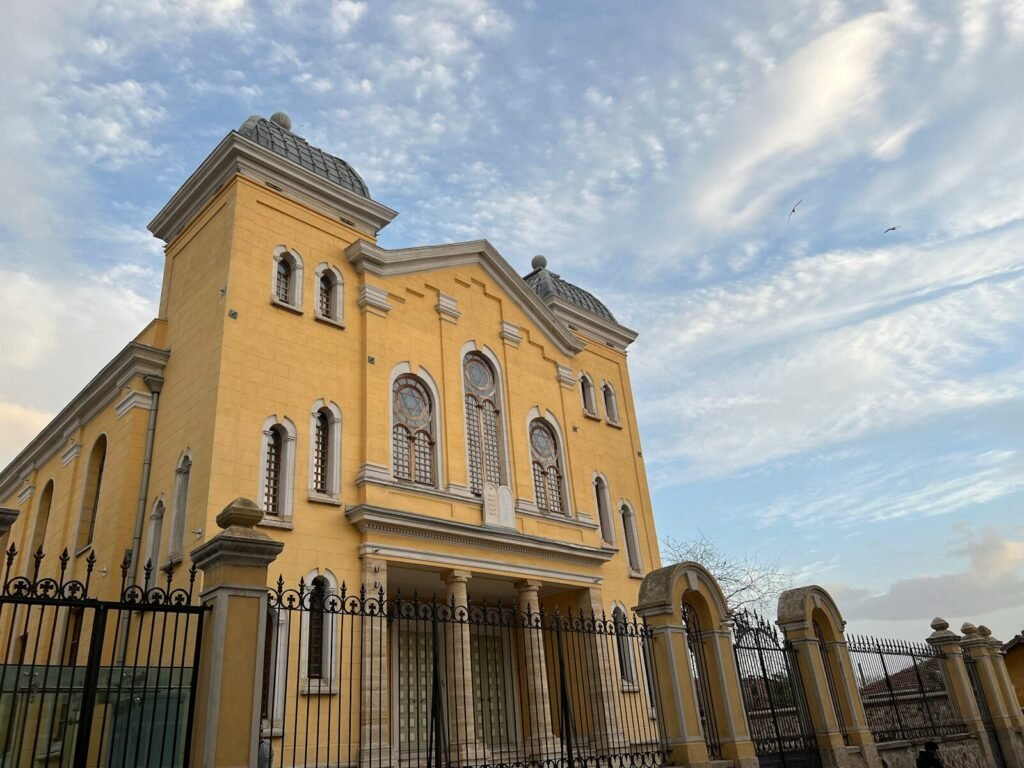 a large building with a fence in front of it