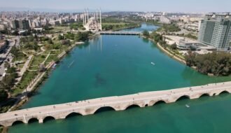 an aerial view of a bridge over a body of water
