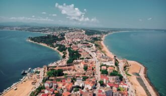 Stunning aerial shot of Sinop's coastline, showcasing vibrant cityscape and serene beaches.
