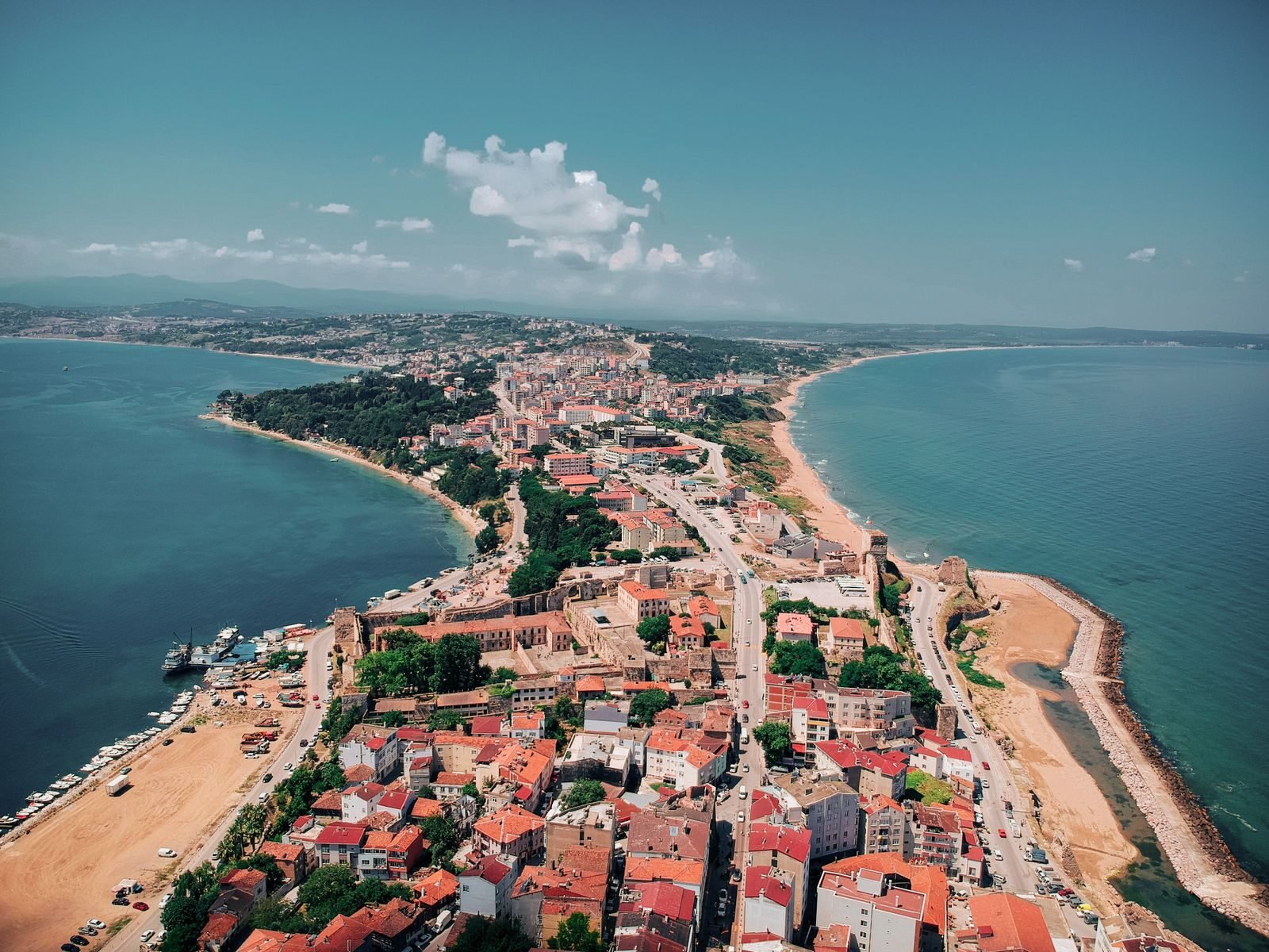 Stunning aerial shot of Sinop's coastline, showcasing vibrant cityscape and serene beaches.