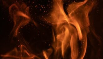 a close up of a fire on a black background