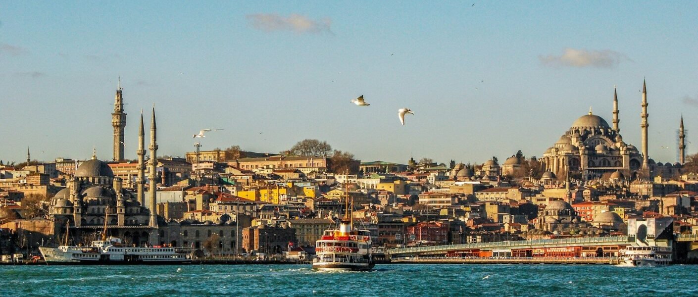 city buildings near body of water during daytime