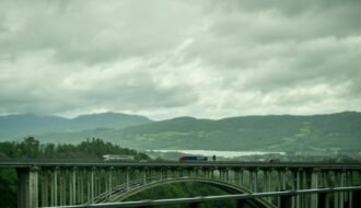 a train crossing a bridge over a river
