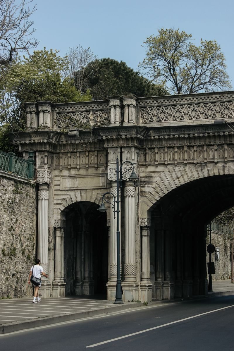 A historic stone bridge overpass in Beşiktaş, İstanbul captured with a view of the street below.