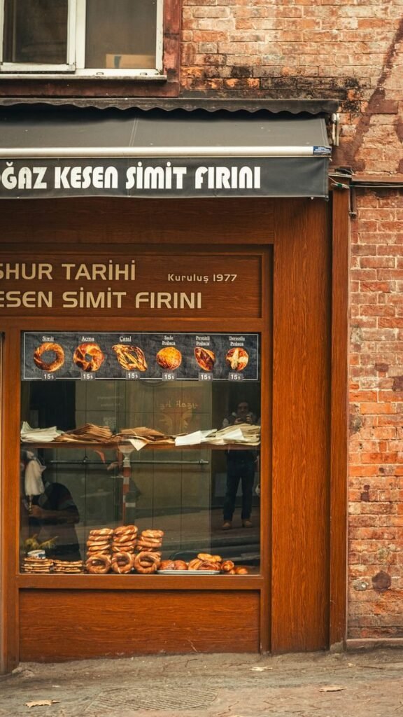 Charming street bakery with simit pastries on display, showcasing historical and cultural ambiance.