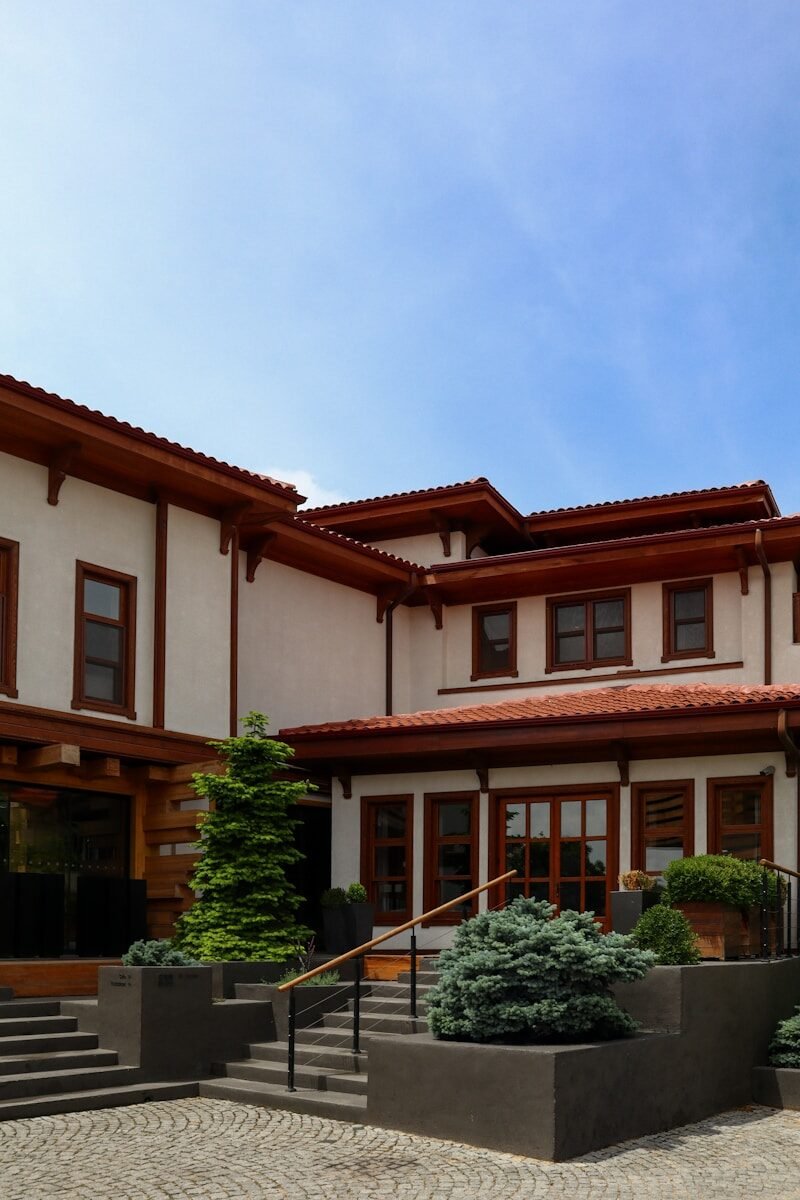 A large white house with a red roof