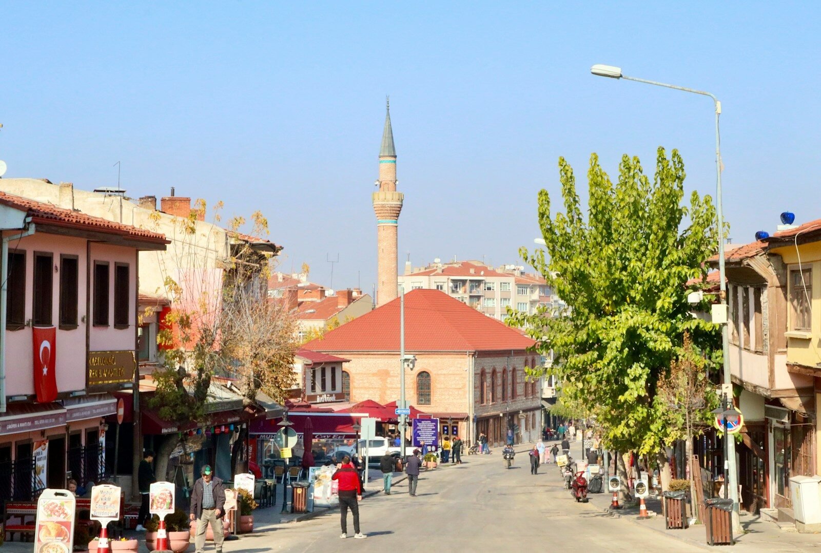 a street with buildings and people