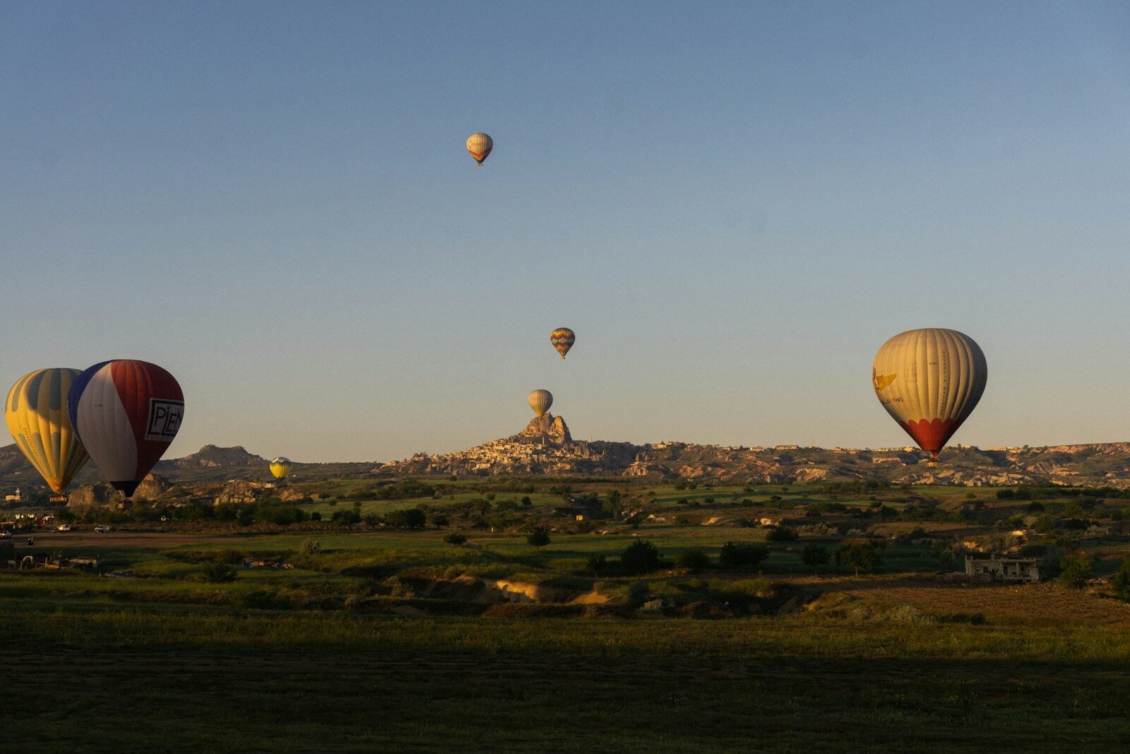 a group of hot air balloons flying in the sky