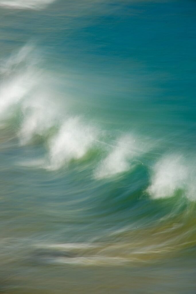 Abstract motion blur of ocean waves crashing on shore