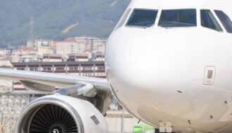 a large jetliner sitting on top of an airport tarmac