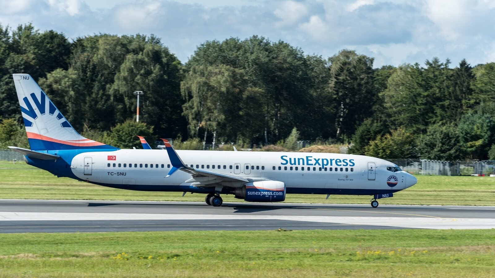 A large passenger jet sitting on top of an airport runway